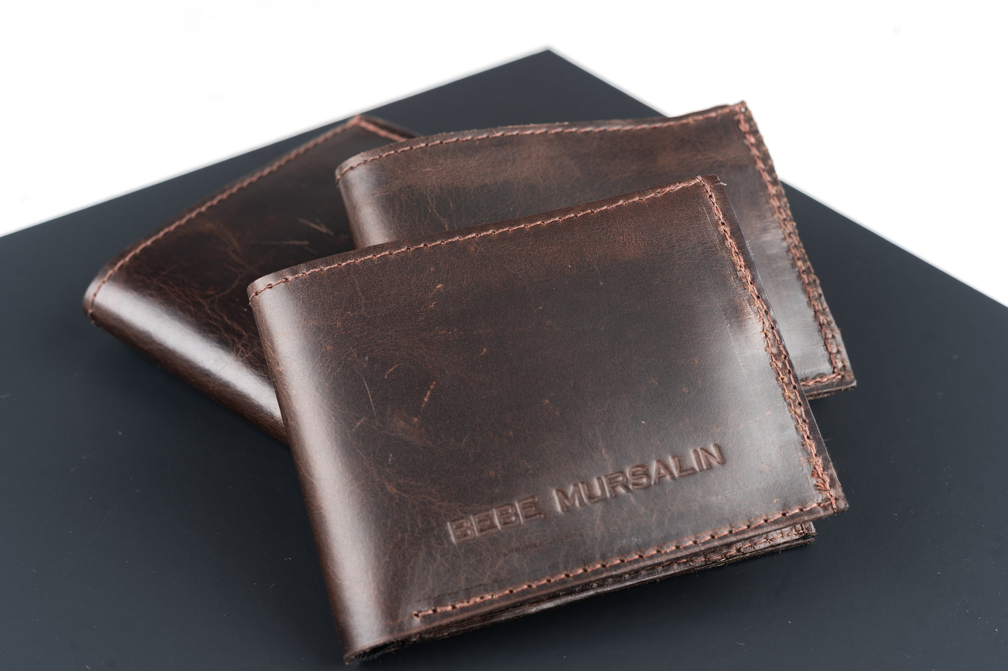 Distressed bi-fold wallet